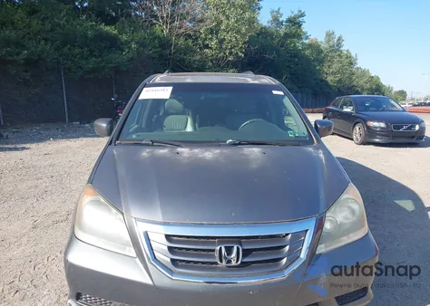 2010 Honda Odyssey Exl z USA, uszkodzony, nr VIN 5FNRL3H65AB114099